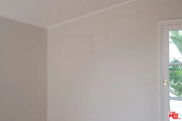 a view of a window in a white room