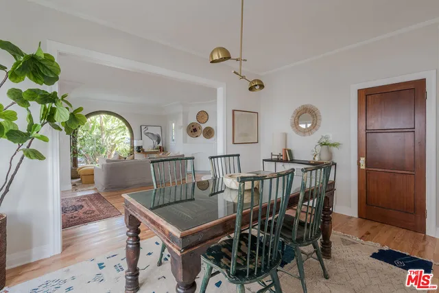 a view of a dining room filled with furniture and window