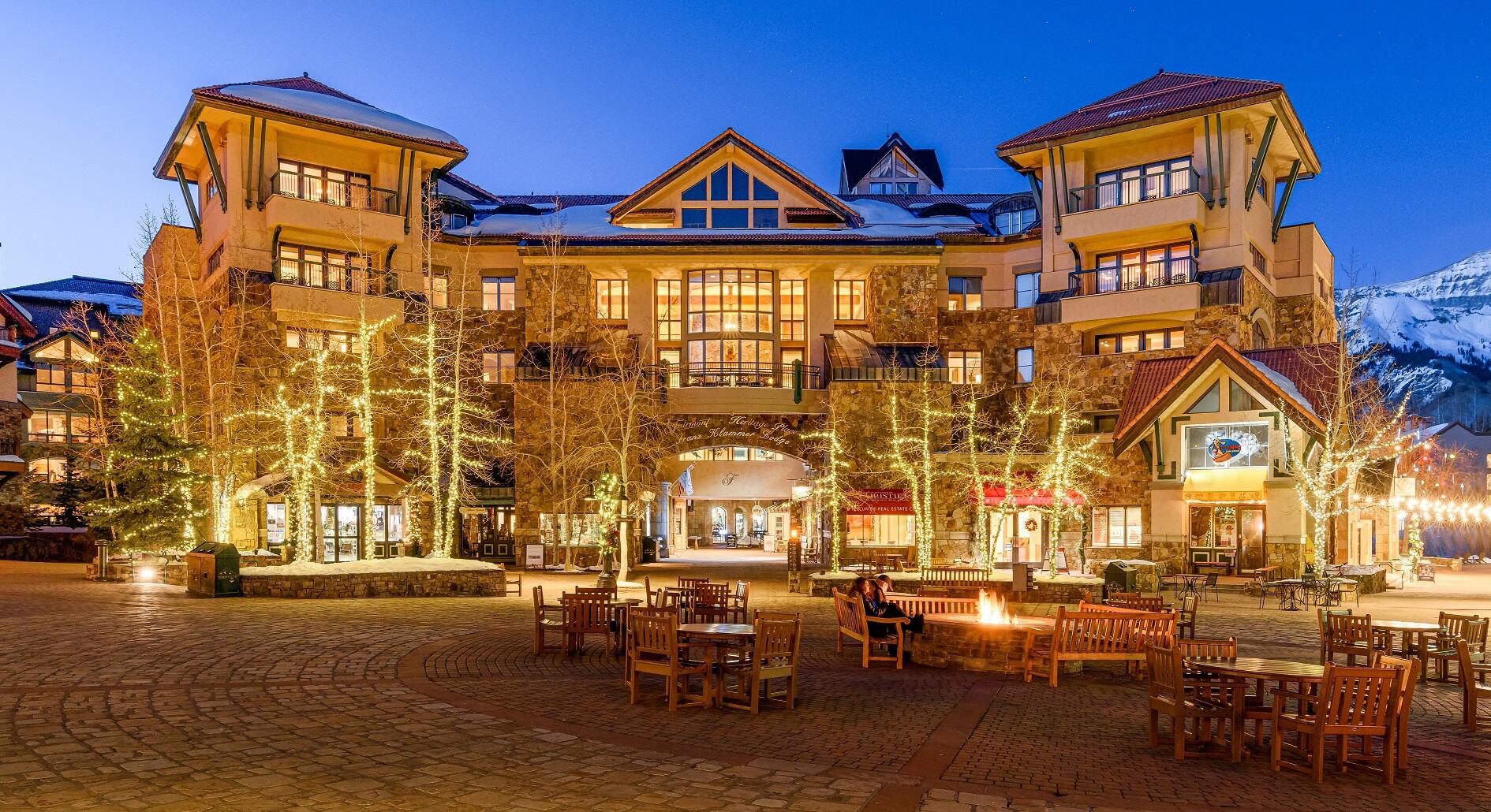 a front view of a building with outdoor seating