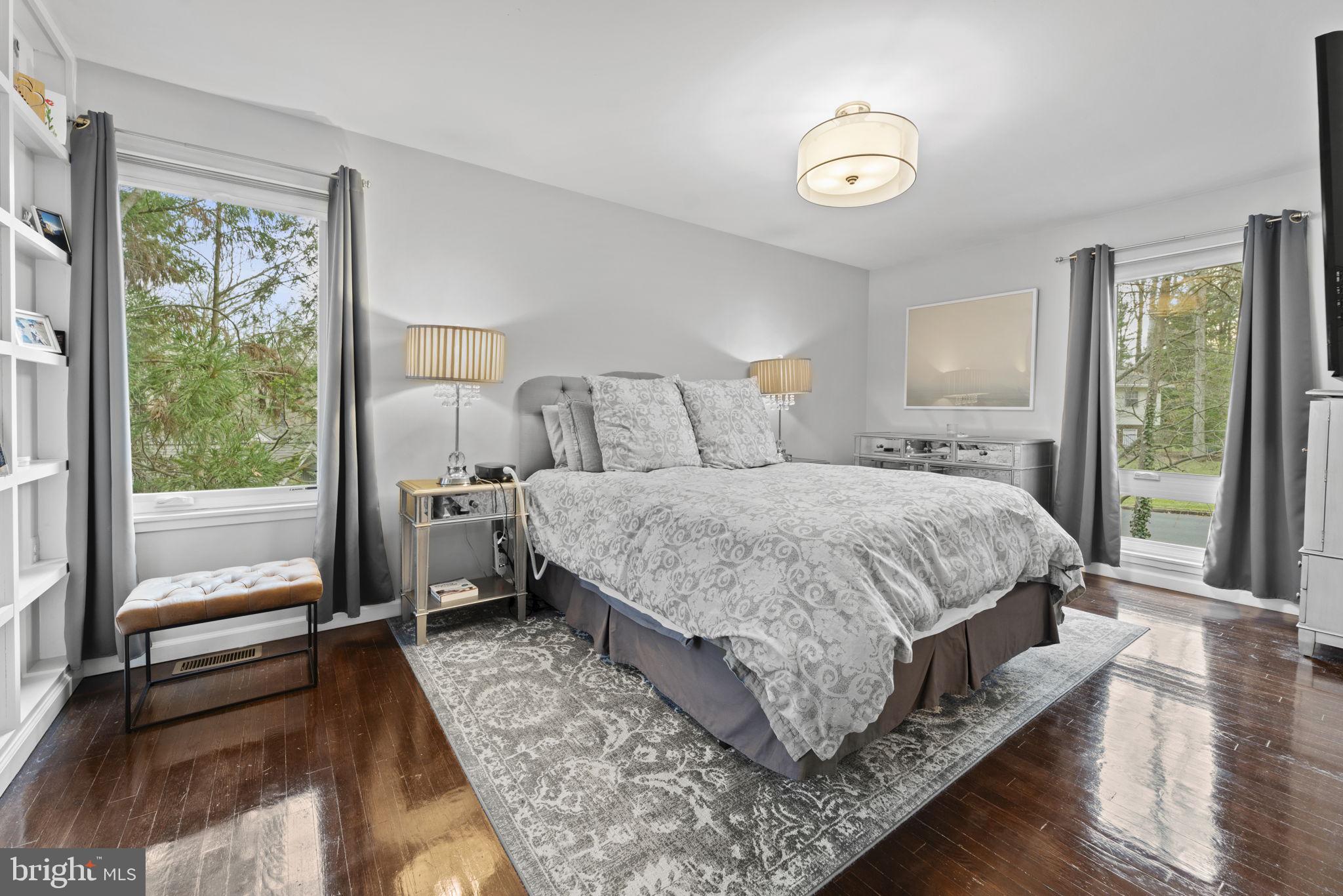 1411 Aldenham Lane Reston, VA 20190 - Photo 11 of 23 a bedroom with a bed and a large window with outer view