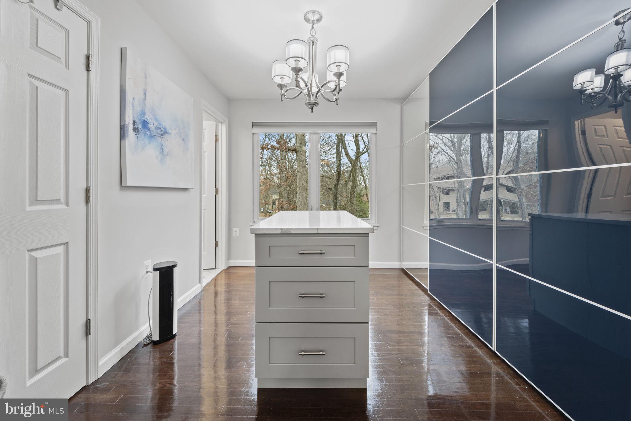 1411 Aldenham Lane Reston, VA 20190 - Photo 13 of 23 a view of a hallway with windows and chandelier