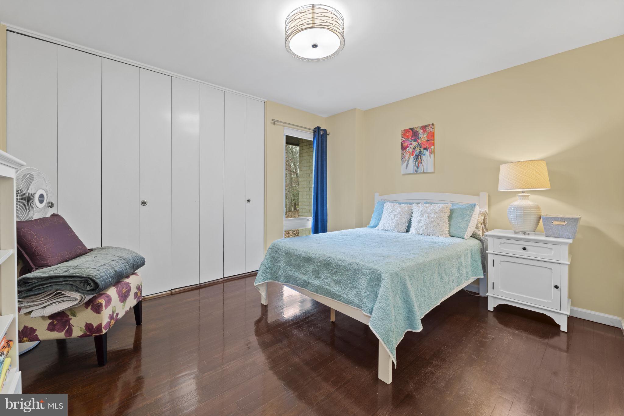 1411 Aldenham Lane Reston, VA 20190 - Photo 17 of 23 a bedroom with a bed and furniture