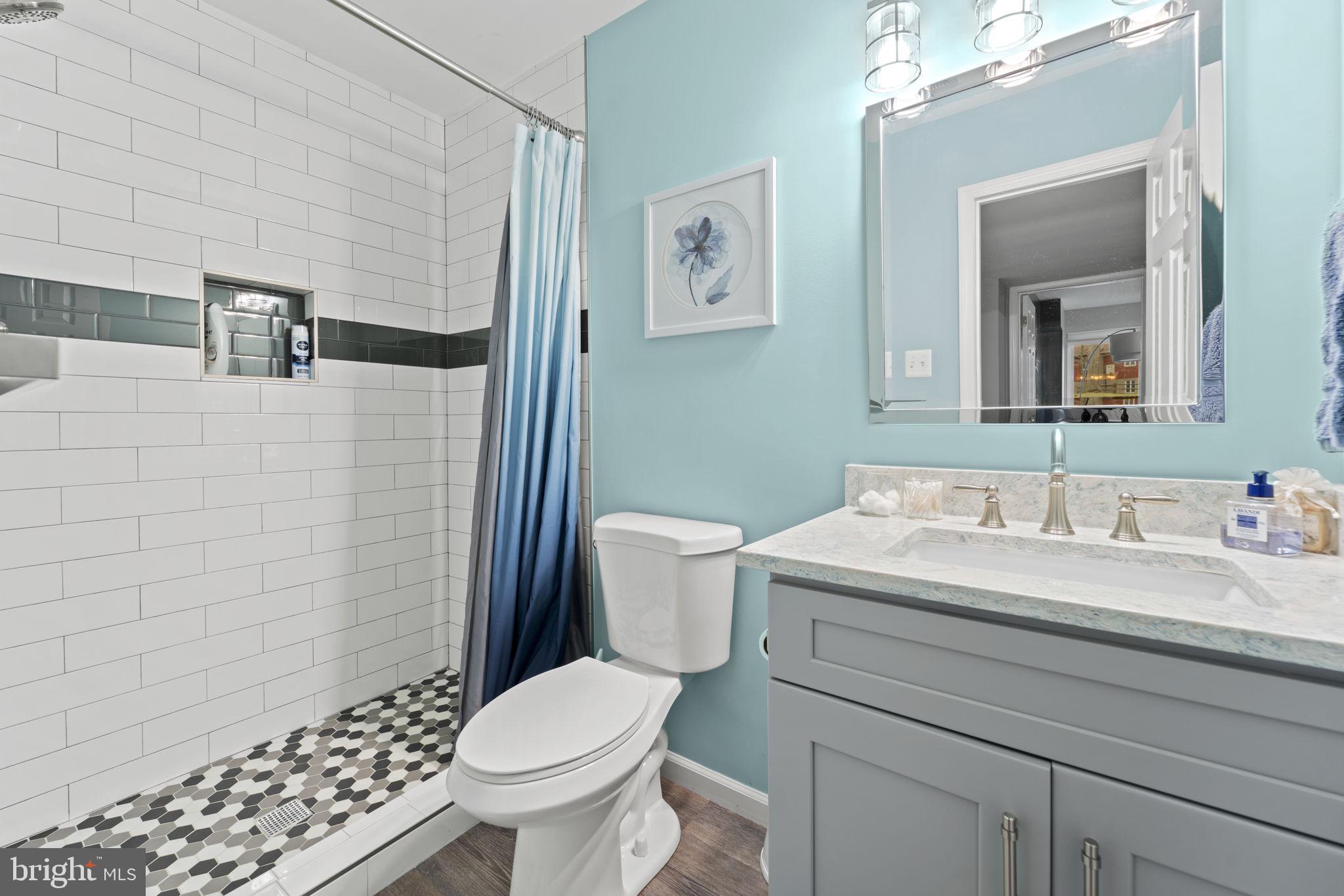 1411 Aldenham Lane Reston, VA 20190 - Photo 20 of 23 a bathroom with a sink toilet and shower