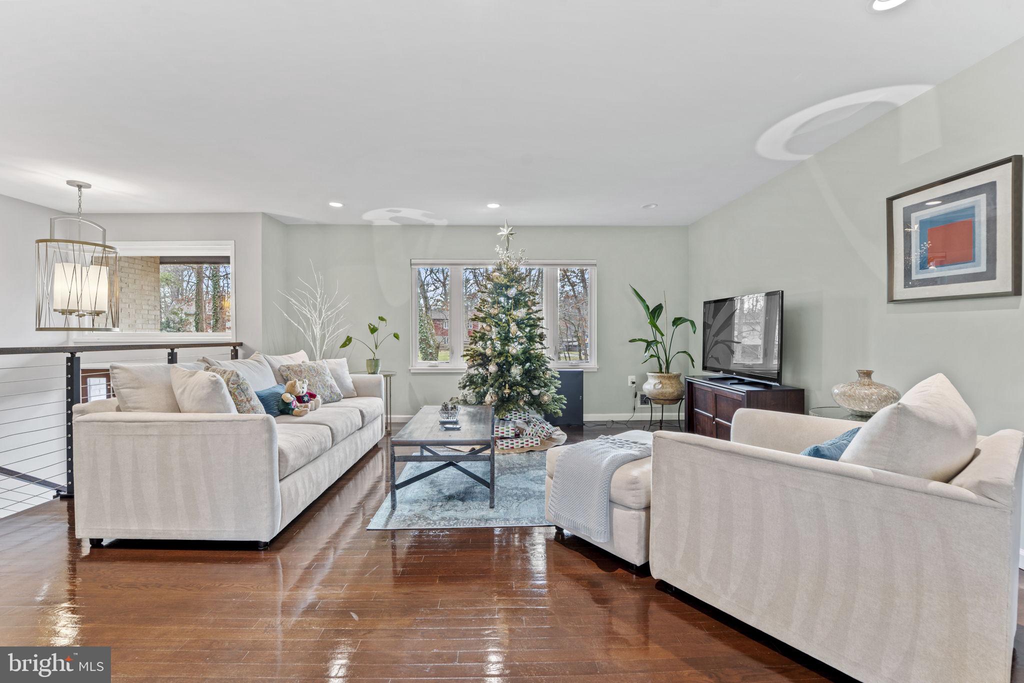 1411 Aldenham Lane Reston, VA 20190 - Photo 4 of 23 a living room with furniture and a large window