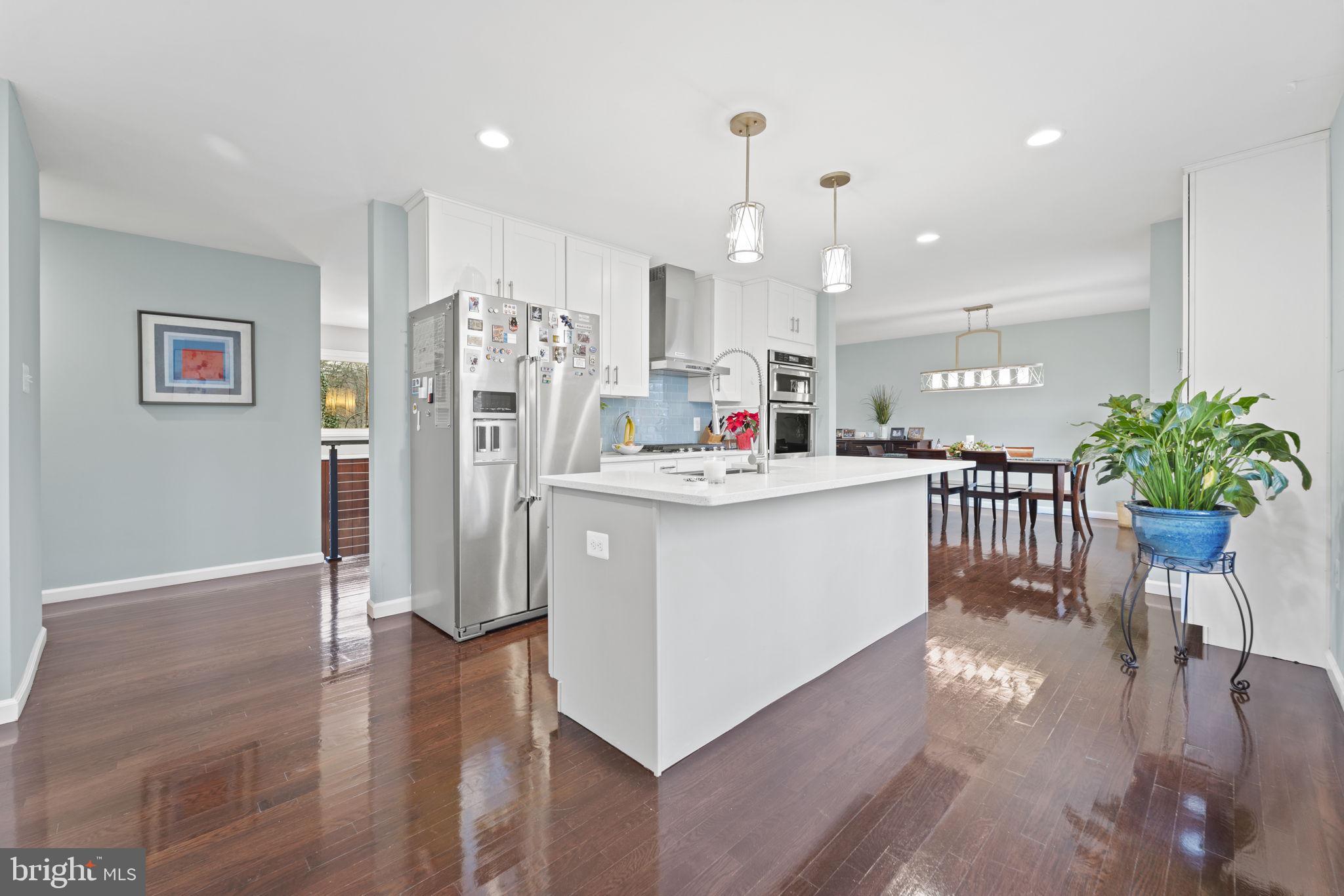 1411 Aldenham Lane Reston, VA 20190 - Photo 8 of 23 a view of kitchen with cabinets and wooden floor