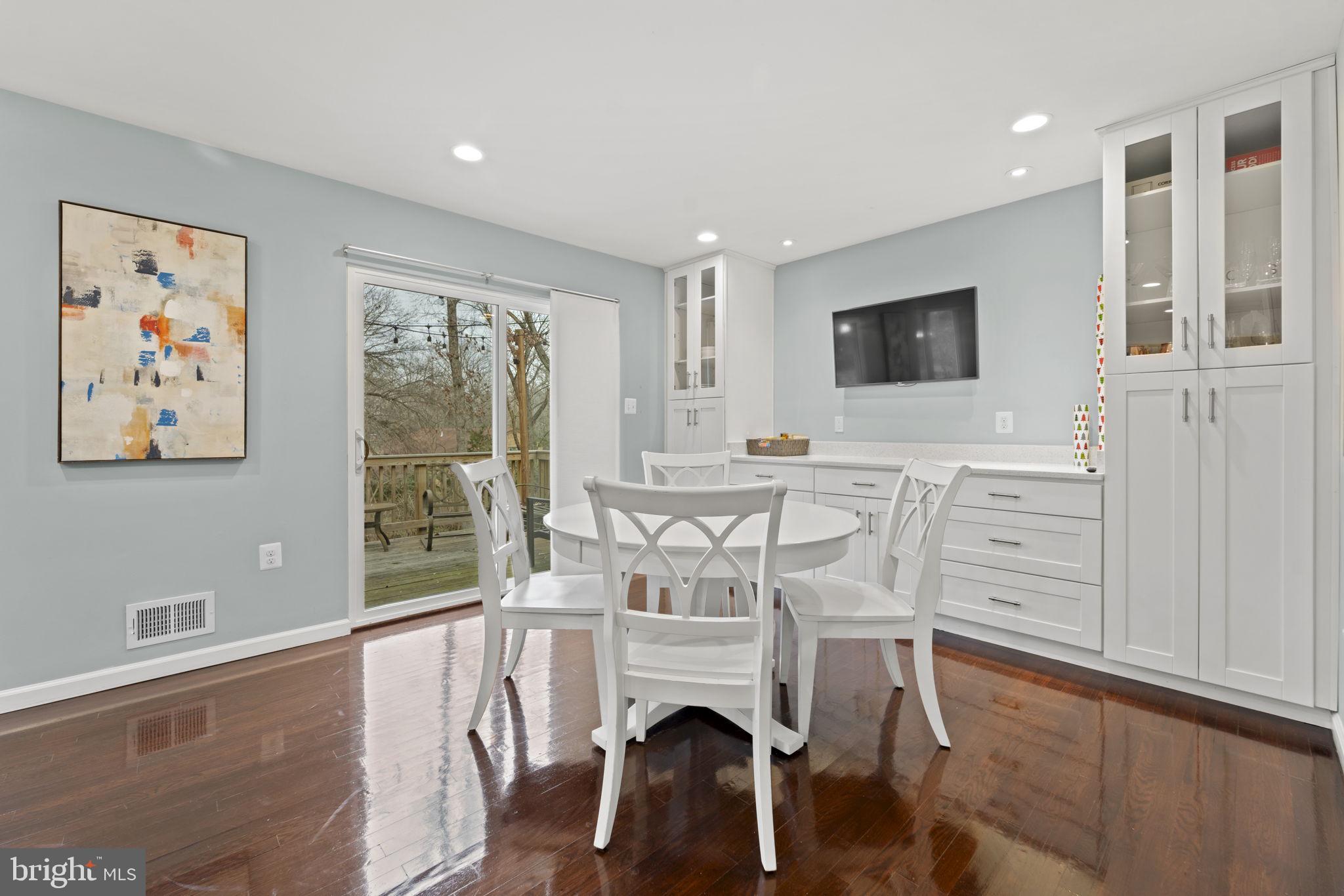 1411 Aldenham Lane Reston, VA 20190 - Photo 9 of 23 a living room with furniture a fireplace and a large window