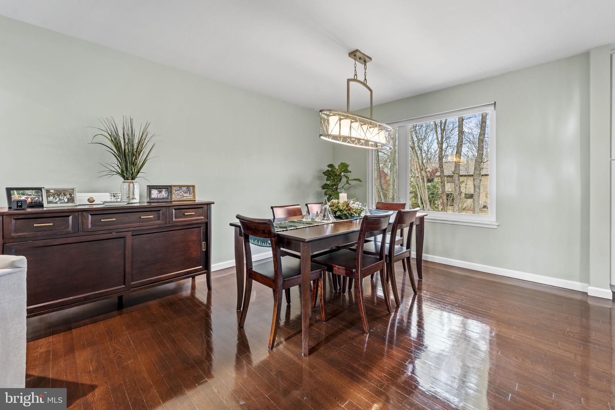 1411 Aldenham Lane Reston, VA 20190 - Photo 10 of 23 a view of a dining room with furniture window and wooden floor