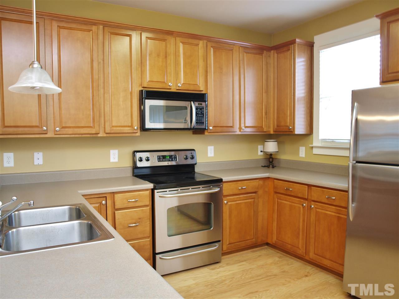 4531 All Points View Way Raleigh, NC 27614 - Photo 23 of 23 a kitchen with a stove a sink and a microwave