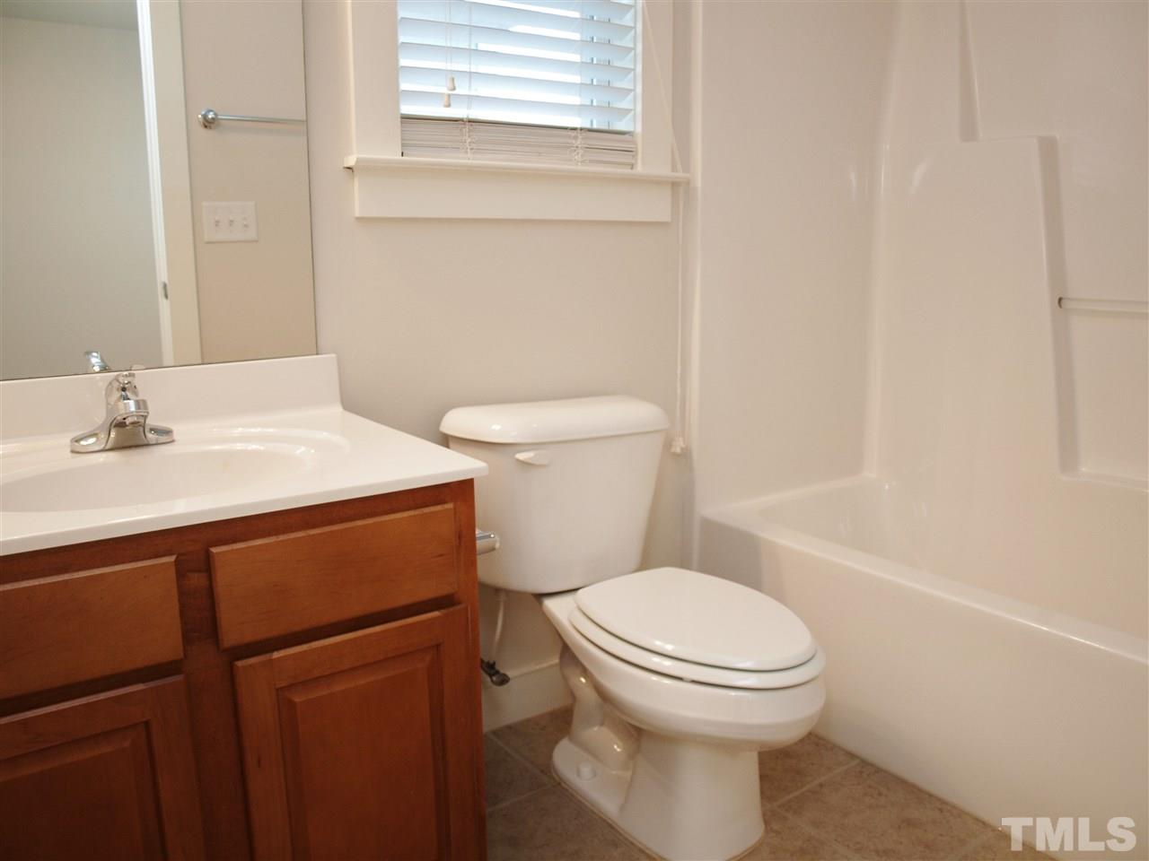 4531 All Points View Way Raleigh, NC 27614 - Photo 10 of 23 a bathroom with a sink a toilet and shower