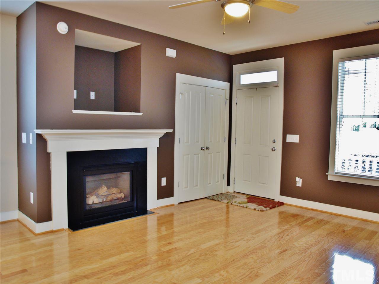 4531 All Points View Way Raleigh, NC 27614 - Photo 5 of 23 a view of an empty room with window and fire place
