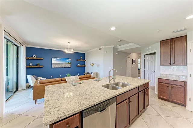 a view of a porch with furniture and floor to ceiling window