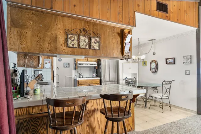 a dining room with furniture and window