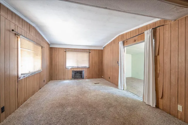a view of a kitchen and a sink and dishwasher in kitchen with wooden floor