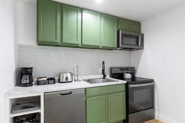 a kitchen with a sink and a microwave