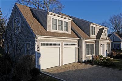 127 West Bay Road, Unit A Osterville, MA 02655 - Photo 1 of 11 a front view of a house with garden