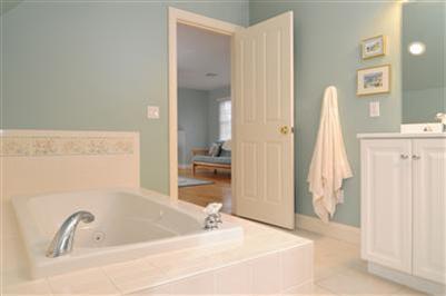 127 West Bay Road, Unit A Osterville, MA 02655 - Photo 11 of 11 a bathroom with a sink and a tub