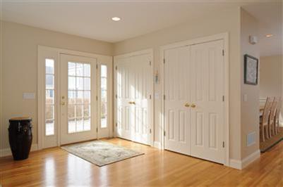 127 West Bay Road, Unit A Osterville, MA 02655 - Photo 3 of 11 a view of an empty room with window and wooden floor