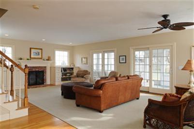 127 West Bay Road, Unit A Osterville, MA 02655 - Photo 4 of 11 a living room with furniture a fireplace and a window