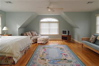 127 West Bay Road, Unit A Osterville, MA 02655 - Photo 9 of 11 a bed room with a bed and a couch