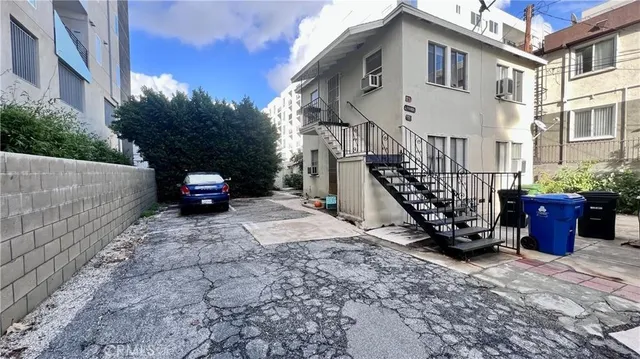 a view of a car park in front of a building