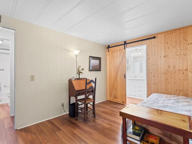 a view of a livingroom with furniture and wooden floor