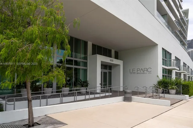 a view of a building with palm trees