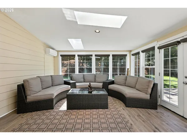 a living room with furniture and a large window