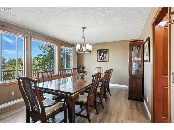 a view of a dining room with furniture window and outside view