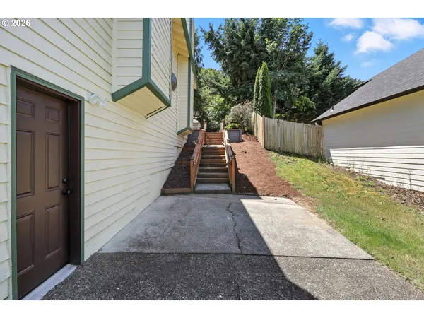 a view of backyard with seating space