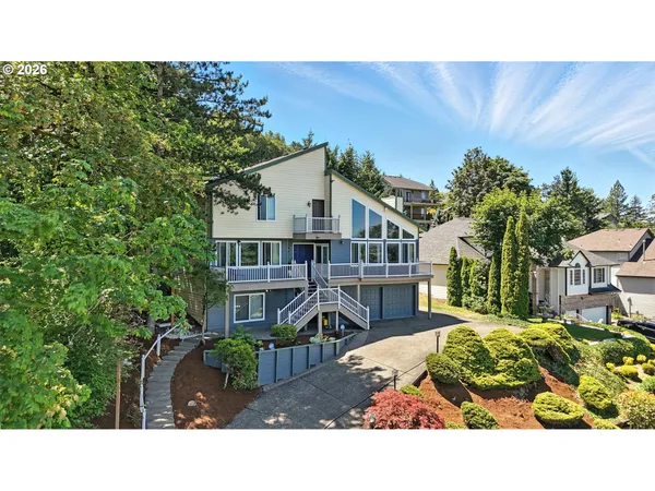 a balcony with furniture and a garden