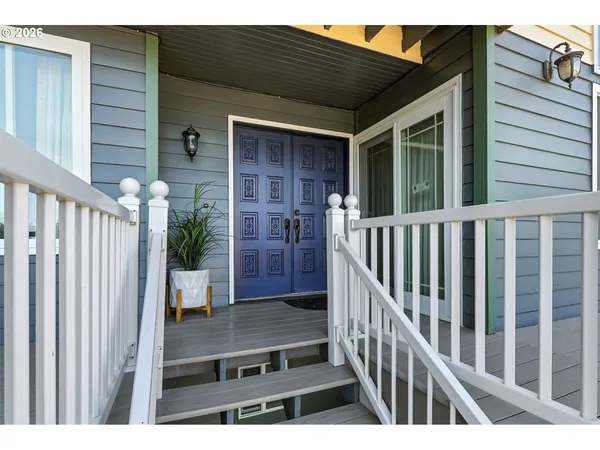 a view of backyard with a deck