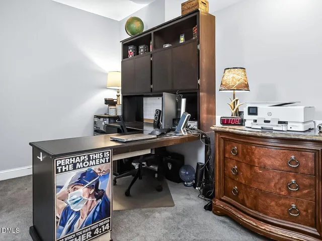 a room with furniture and painting on the wall