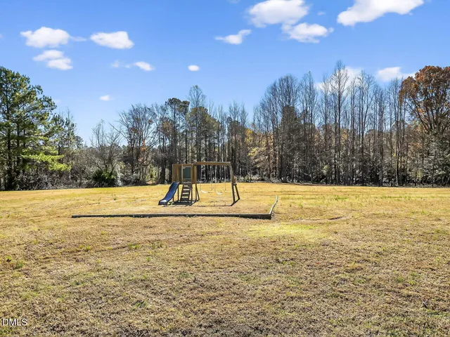 a view of a swimming pool with an outdoor space and seating area