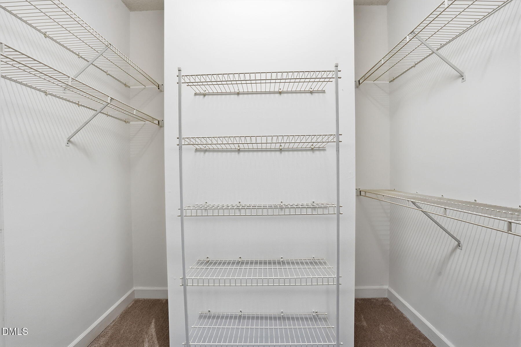 1210 Shadow Bark Court Raleigh, NC 27603 - Photo 8 of 29 a view of walk in closet with empty racks