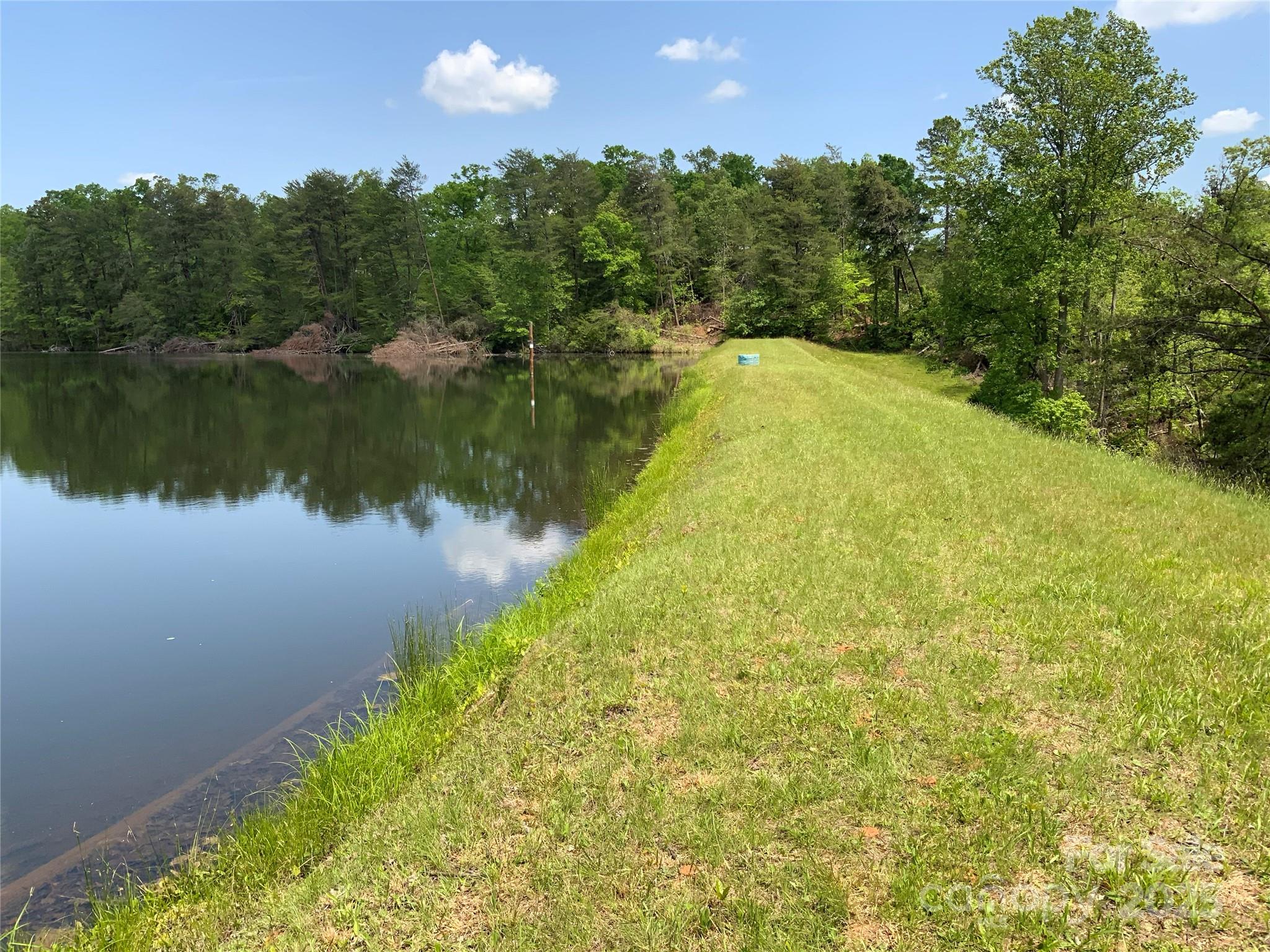 0 Navaho Trail, Unit 19 Rutherfordton, NC 28139 - Photo 4 of 11 a view of a lake with a yard