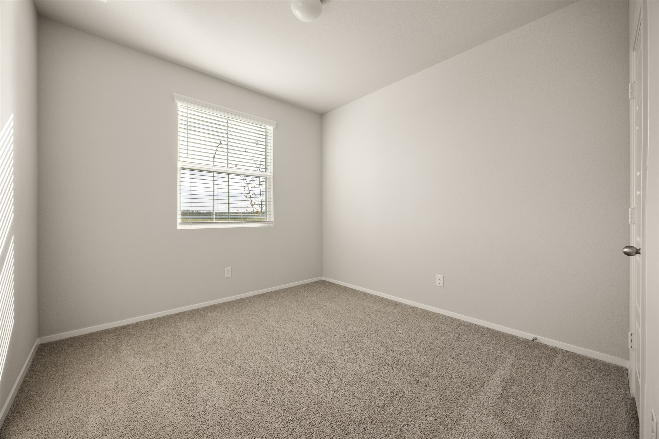 160 Backwater Road Kyle, TX 78640 - Photo 12 of 15 Carpeted spare room featuring baseboards
