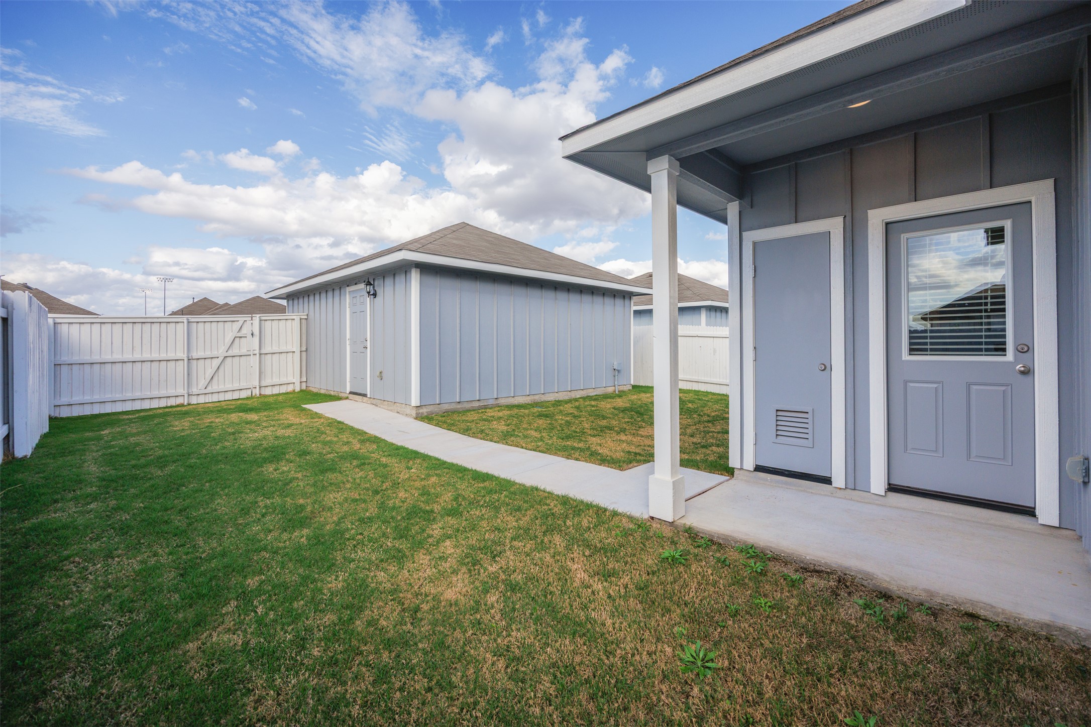 160 Backwater Road Kyle, TX 78640 - Photo 15 of 15 Fenced backyard with an outdoor structure and a patio area