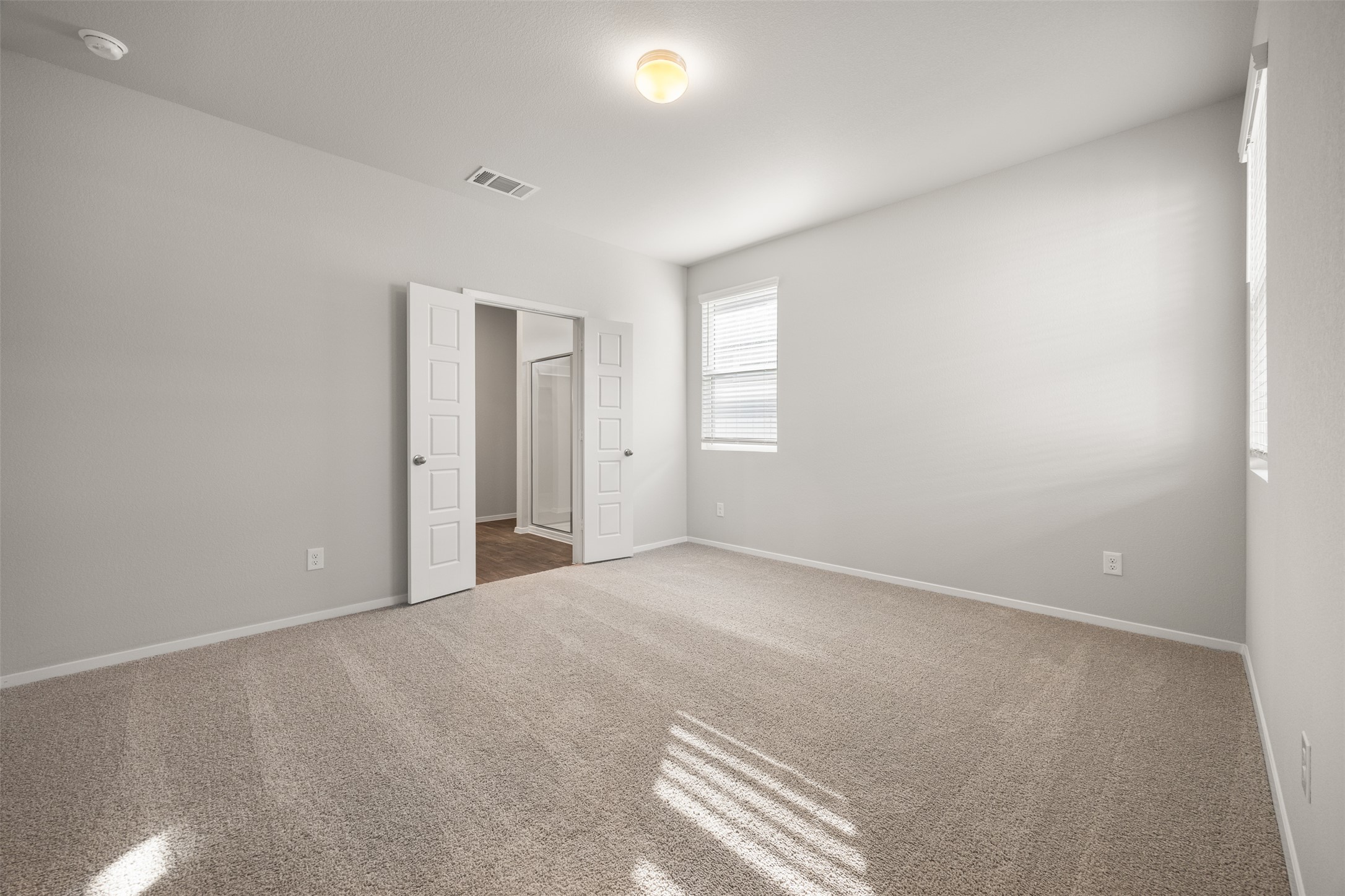 160 Backwater Road Kyle, TX 78640 - Photo 8 of 15 Unfurnished bedroom with carpet floors and baseboards