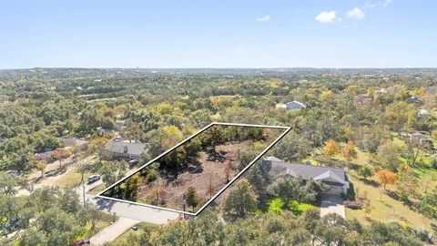 an aerial view of house with yard