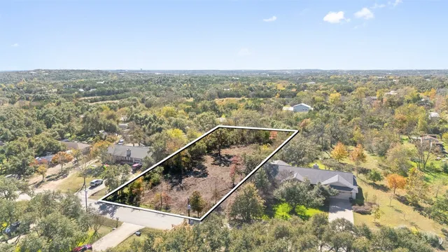 an aerial view of house with yard
