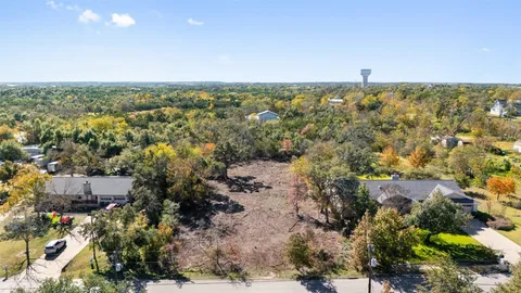 an aerial view of residential building and green space