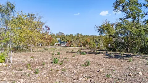 a view of outdoor space with trees all around