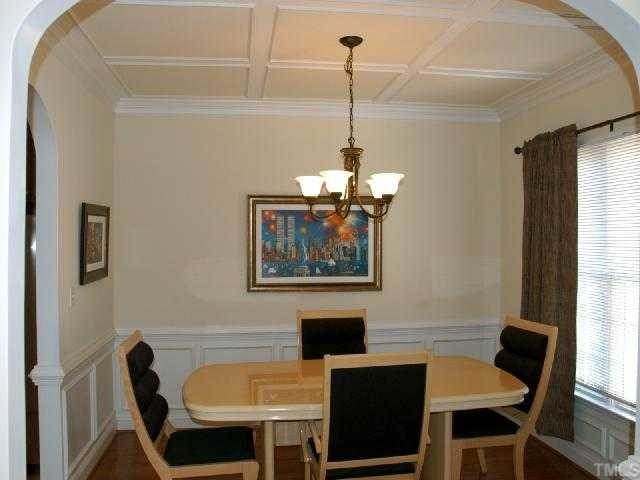 306 Challenge Road Raleigh, NC 27603 - Photo 4 of 12 Formal dining with wainscotting and coffered ceilings Dining Room