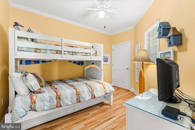 a bedroom with a bed and flat screen tv