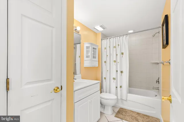 a bathroom with a shower a toilet and a shower