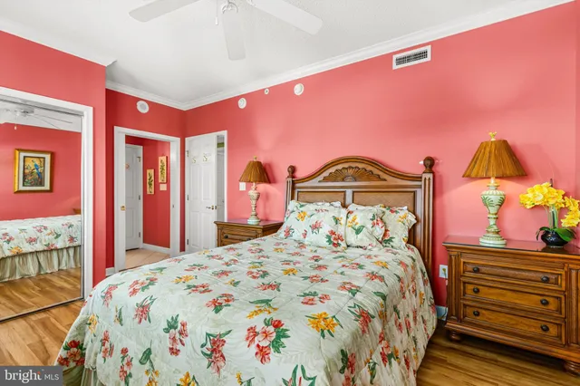 a bedroom with a bed and a dresser