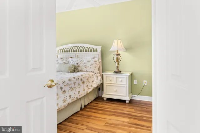 a room with a bed and a night stand