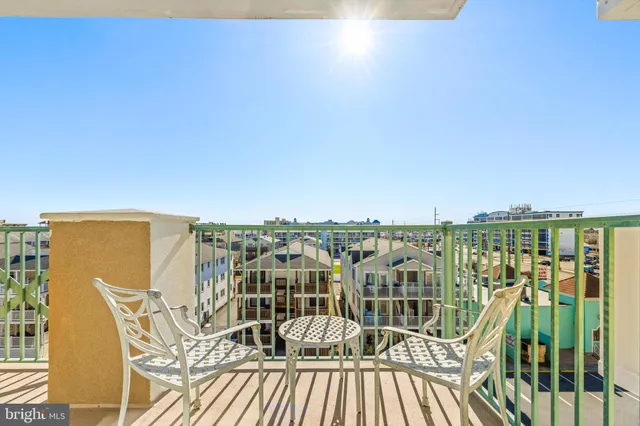 a view of a balcony with table and chairs