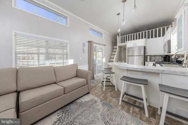 a large white bed in a white room