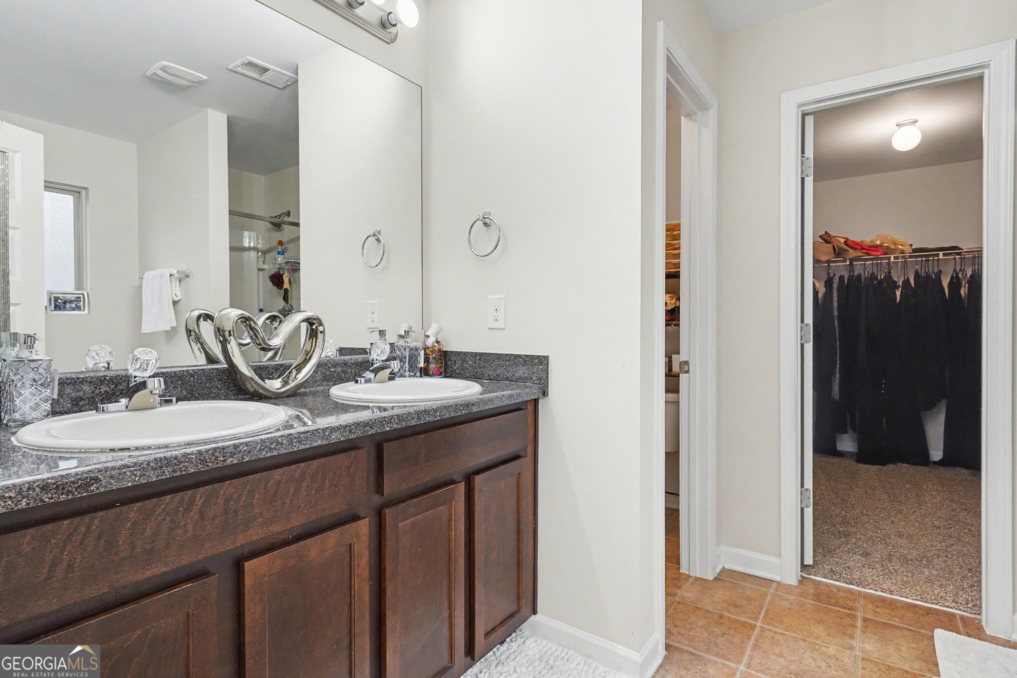 1241 England Terrace Hampton, GA 30228 - Photo 11 of 20 a bathroom with a granite countertop sink and a mirror